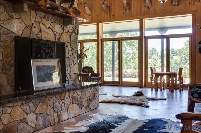 a room with patio furniture and a table