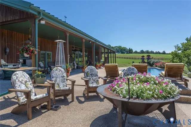 a living room filled with furniture hardwood floor and a large window