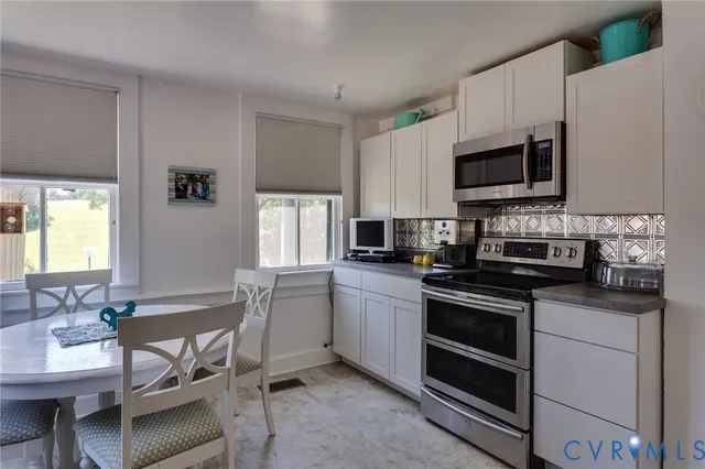 a kitchen with stainless steel appliances a refrigerator and a sink
