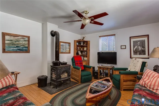 a bedroom with bed and a chandelier