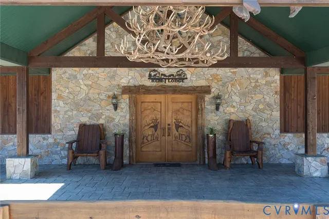 an entryway with a bench and a fireplace