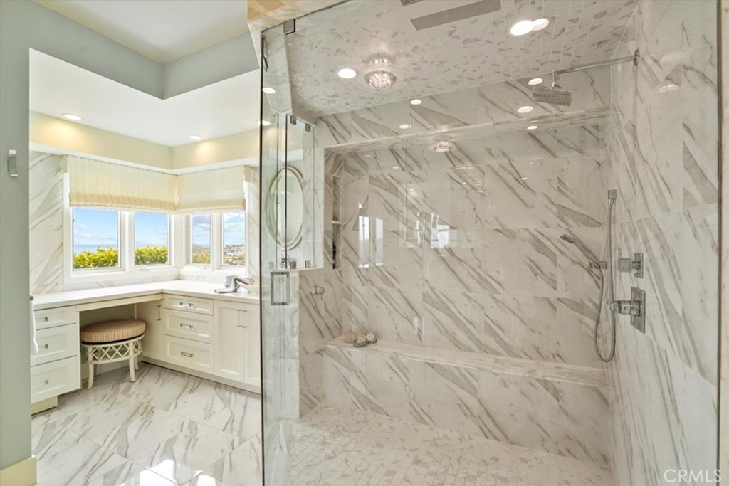 437 Emerald Bay Laguna Beach, CA 92651 - Photo 20 of 61 a bathroom with a granite countertop sink a toilet and shower