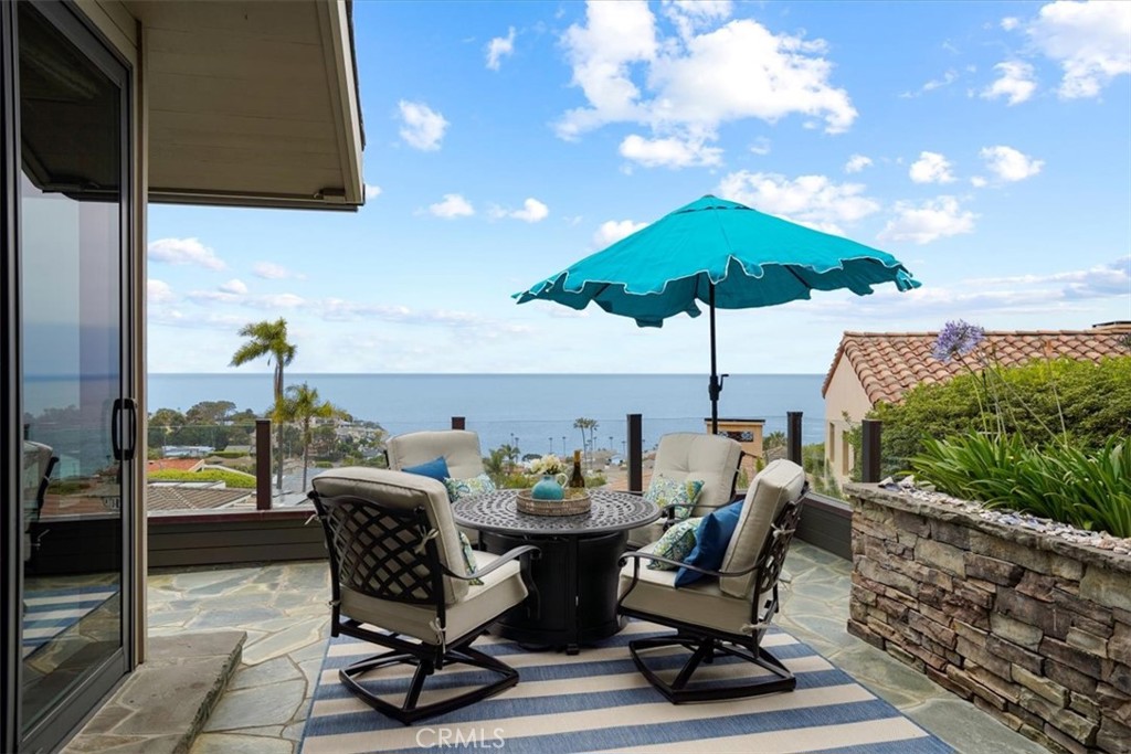 437 Emerald Bay Laguna Beach, CA 92651 - Photo 38 of 61 a view of a patio with a table and chairs