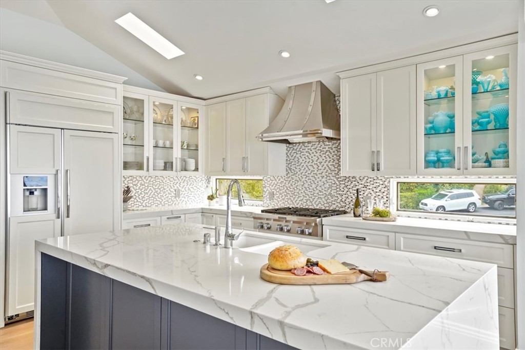 437 Emerald Bay Laguna Beach, CA 92651 - Photo 42 of 61 a kitchen with a sink stove and cabinets