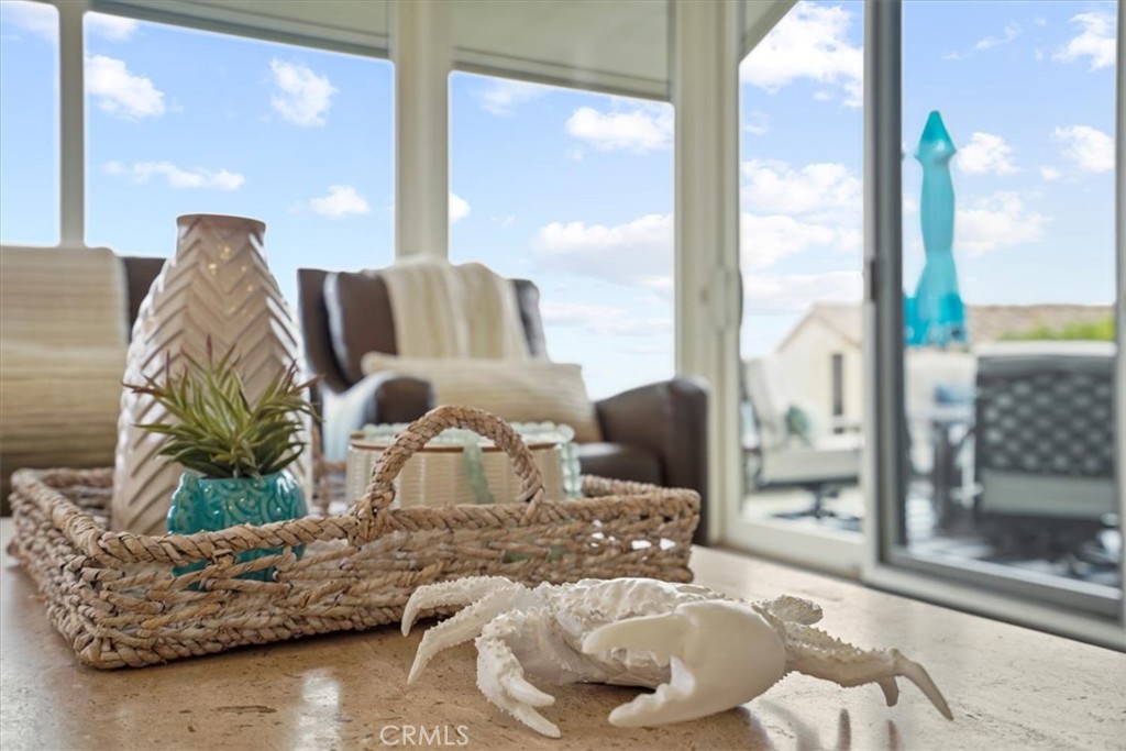 437 Emerald Bay Laguna Beach, CA 92651 - Photo 52 of 61 a living room with furniture and a floor to ceiling window
