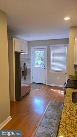 a view of a livingroom with a fireplace and window