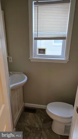 a bathroom with a toilet and a sink