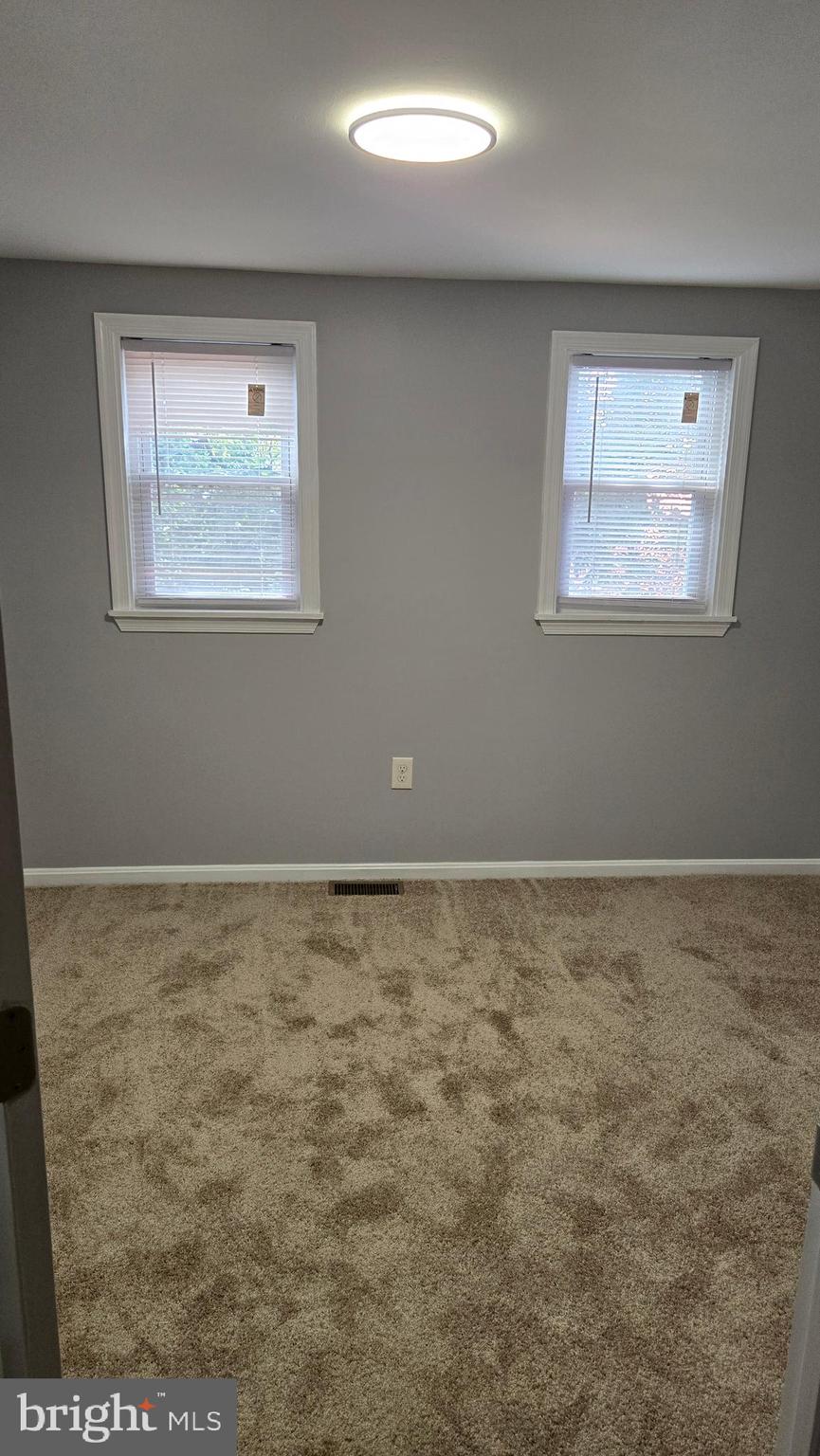 638 Wyeth Street Baltimore, MD 21230 - Photo 7 of 14 a view of an empty room with a window
