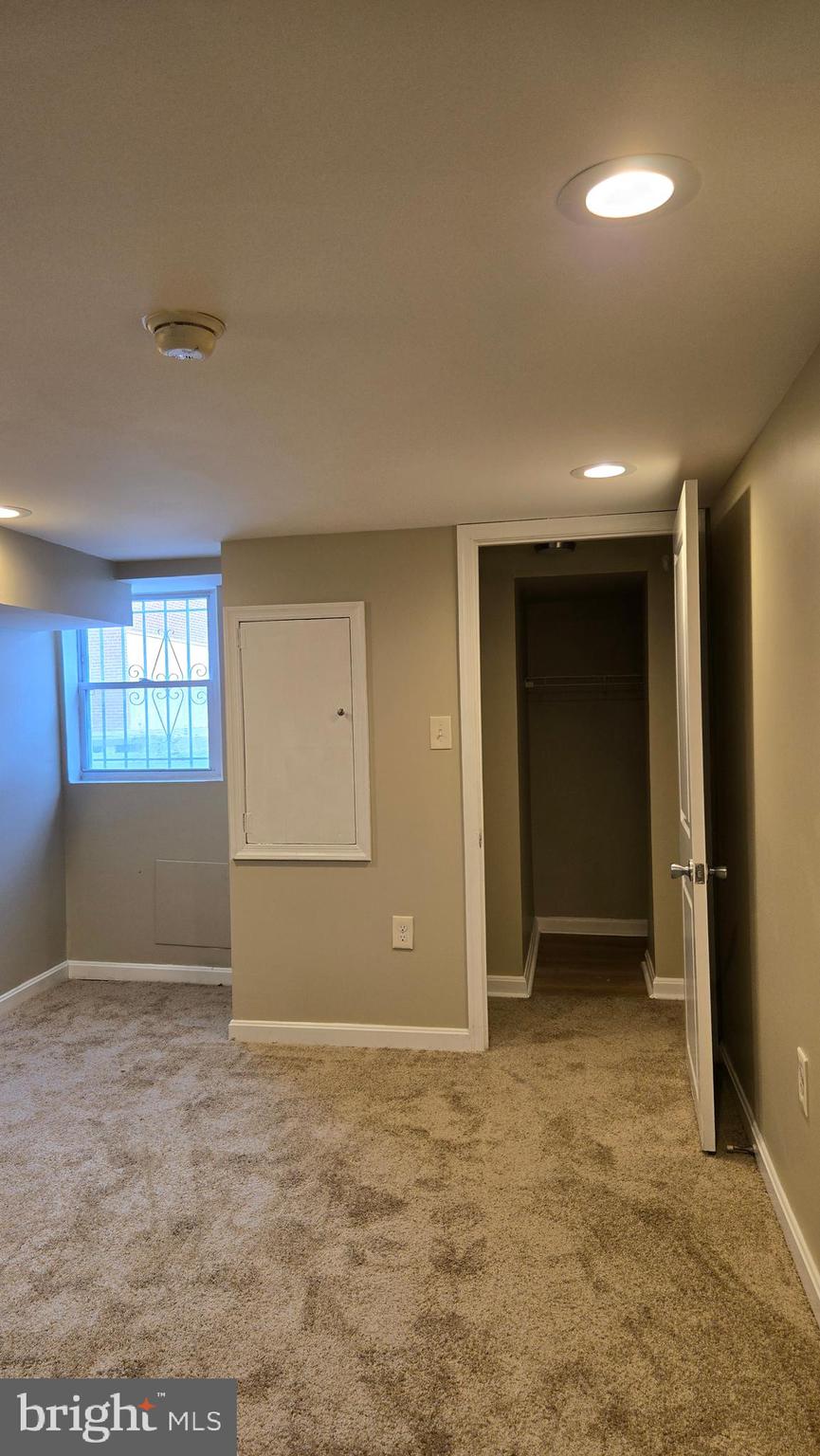 638 Wyeth Street Baltimore, MD 21230 - Photo 9 of 14 an empty room with windows and closet