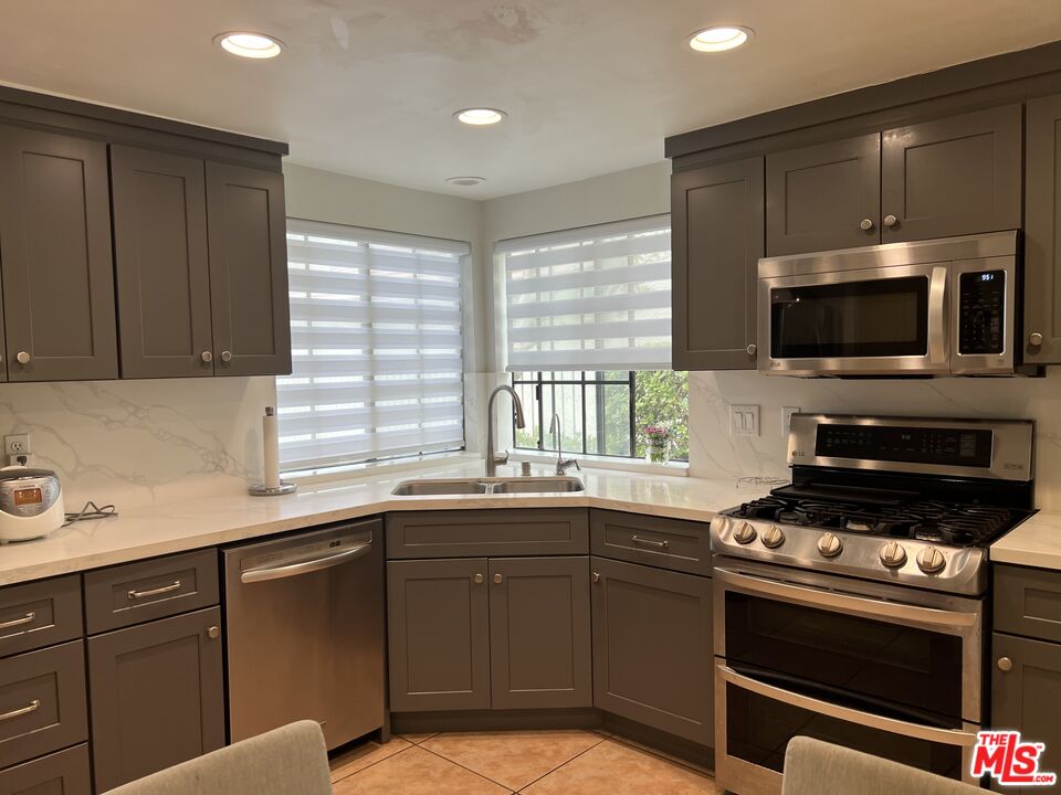 19528 Eagle Ridge Lane Porter Ranch, CA 91326 - Photo 4 of 20 a kitchen with a sink and appliances