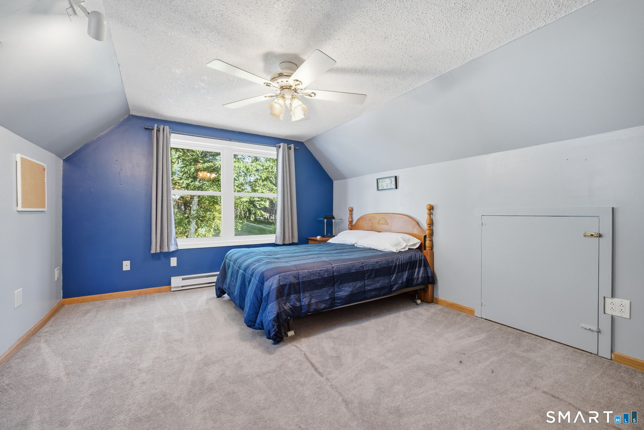 141 Hop River Road Coventry, CT 06238 - Photo 23 of 40 a spacious bedroom with a bed and window