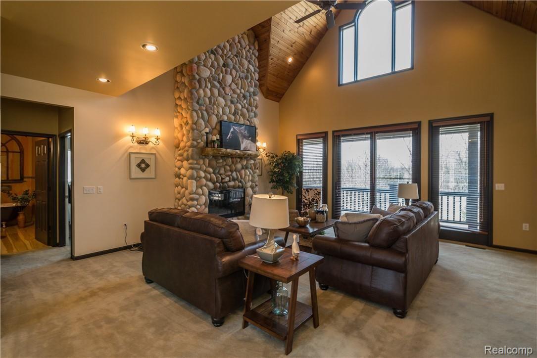 4760 Winding Way Howell, MI 48843 - Photo 8 of 59 Great Room with Stone Fireplace and Knotty Pine 2 Story Ceilings