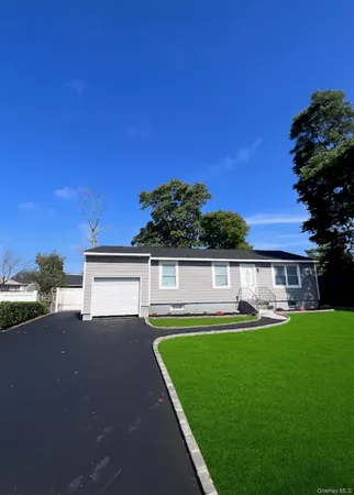 a front view of a house with a yard table and chairs