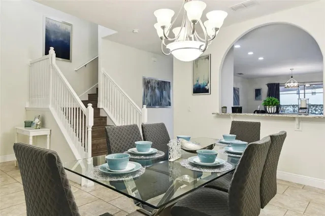 a dining room with furniture and window