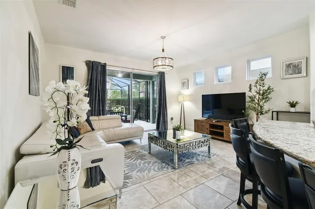 a kitchen with stainless steel appliances kitchen island granite countertop a stove refrigerator and sink