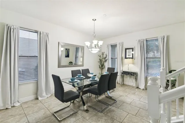 a view of a room with wooden floor and windows