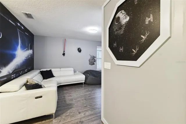 a bathroom with a shower and a glass door