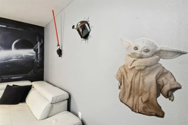 an aerial view of a residential houses with outdoor space and street view