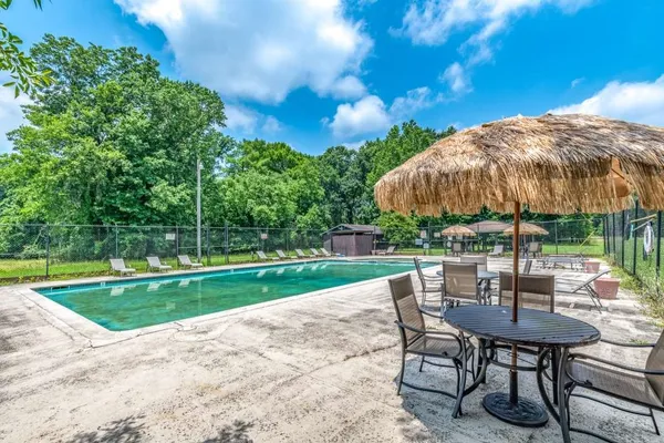a view of a backyard with sitting area