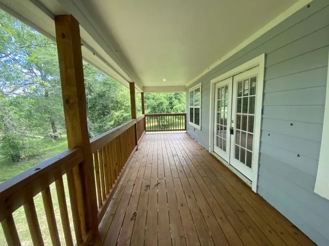 a view of a room with wooden floor and city view