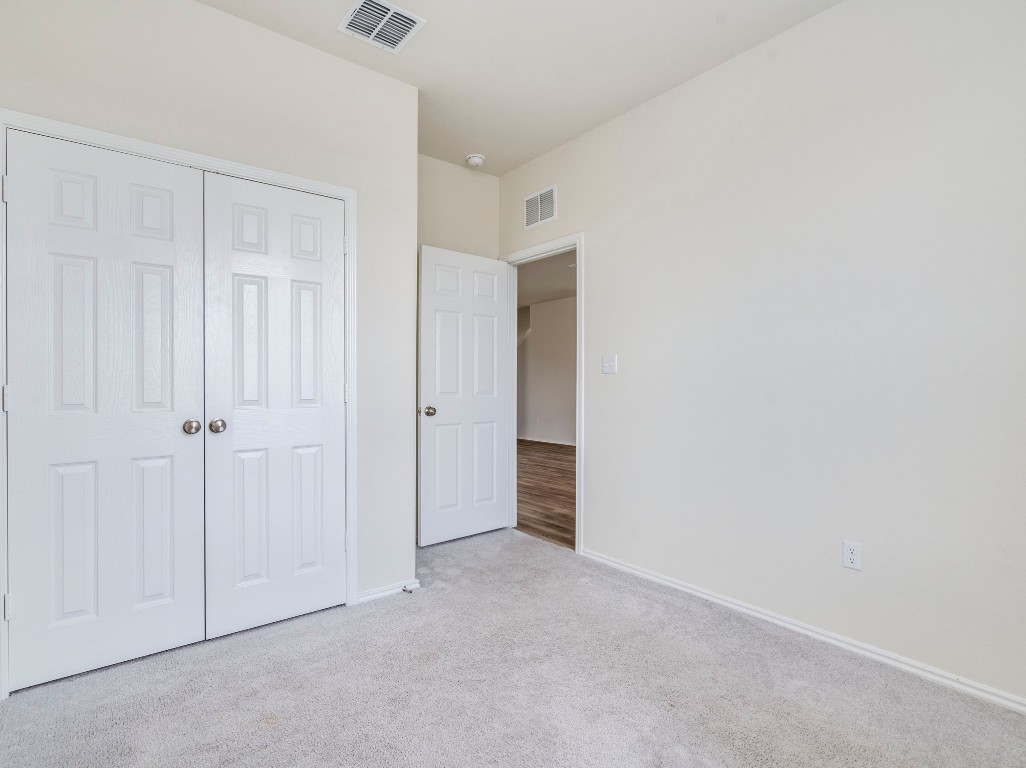 453 Tree Nut Loop Buda, TX 78610 - Photo 11 of 32 First floor offers a bedroom and full bath is perfect for multi-gen living or guest quarters.