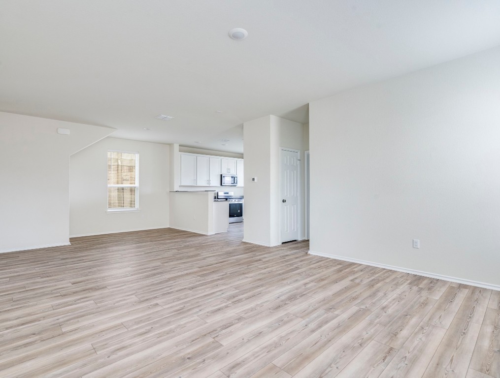 453 Tree Nut Loop Buda, TX 78610 - Photo 4 of 32 Open and functional first floor layout is great for entertaining.