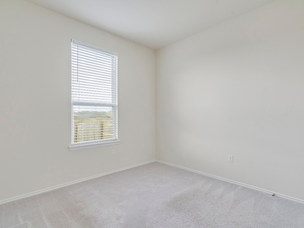 453 Tree Nut Loop Buda, TX 78610 - Photo 10 of 32 First floor offers a bedroom and full bath is perfect for multi-gen living or guest quarters.