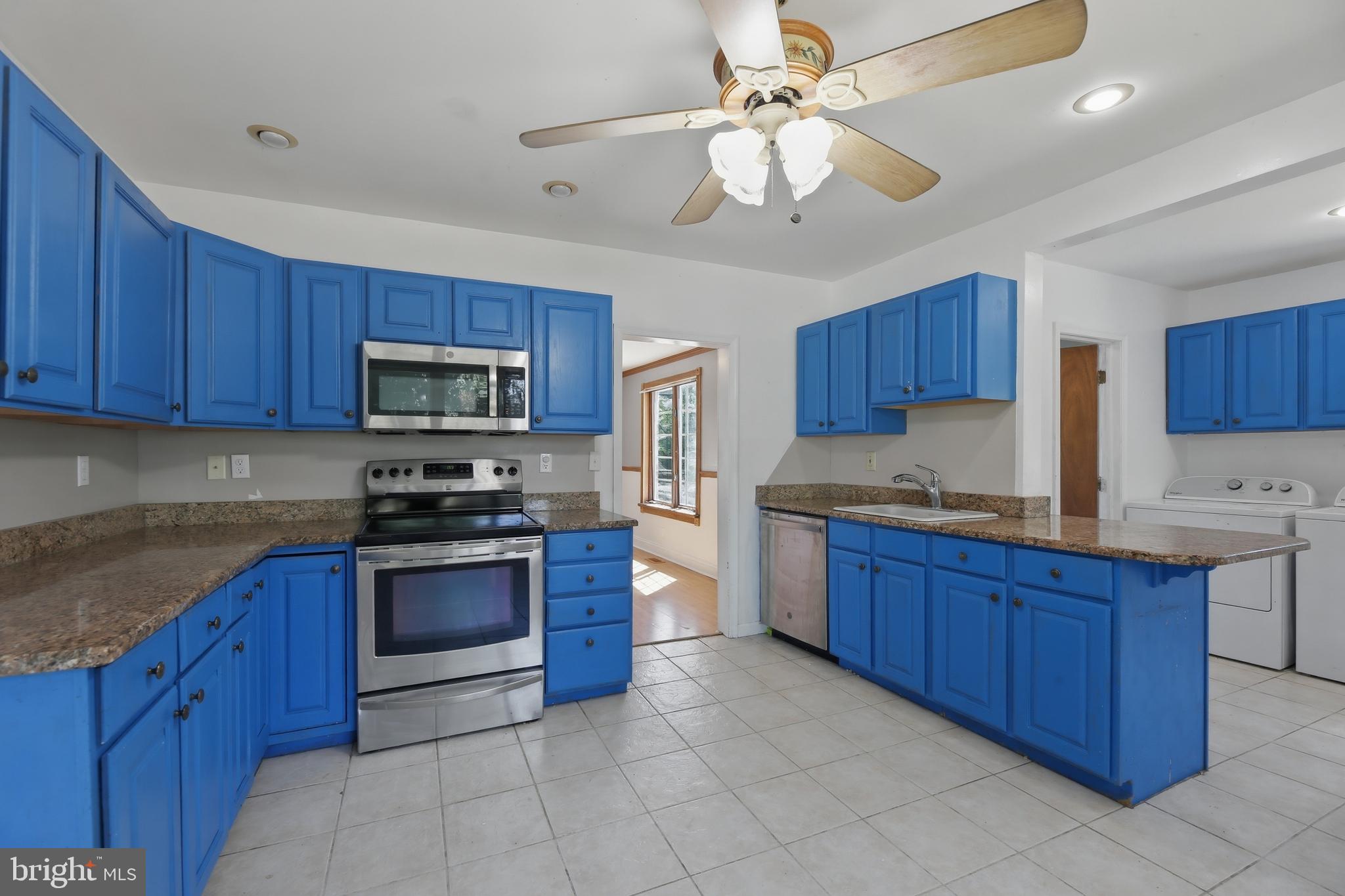 448 North Chew Road Hammonton, NJ 08037 - Photo 10 of 45 Vibrant blue kitchen with modern flair.