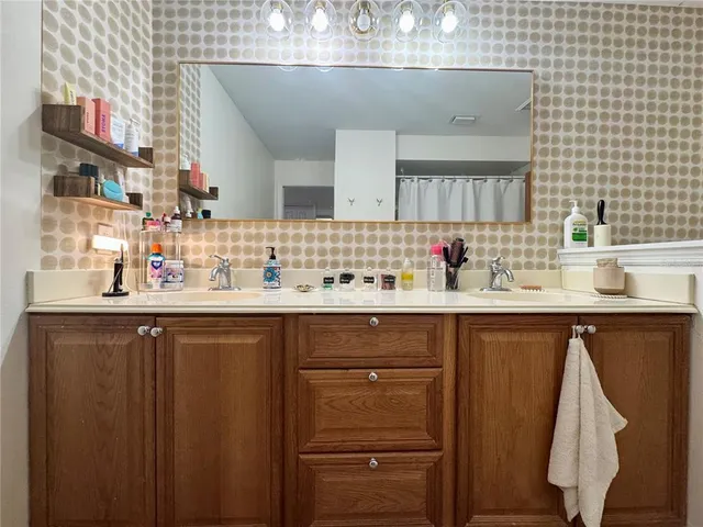 a kitchen with a sink and cabinets