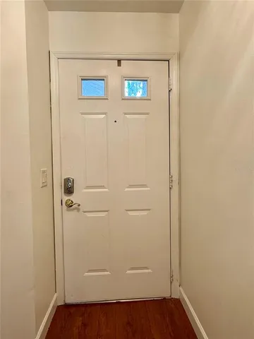 an empty room with wooden floor