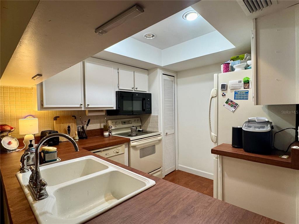 5169 Lazy Oaks Drive Winter Park, FL 32792 - Photo 5 of 25 a view of a kitchen with sink stove and wooden floor