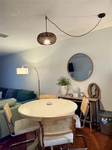 a view of a dining room with furniture
