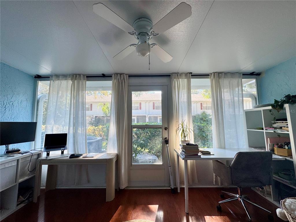 5169 Lazy Oaks Drive Winter Park, FL 32792 - Photo 10 of 25 a view of a workspace with furniture and a window