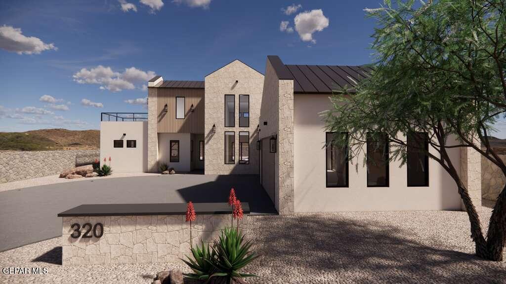 a view of a house with backyard and sitting area