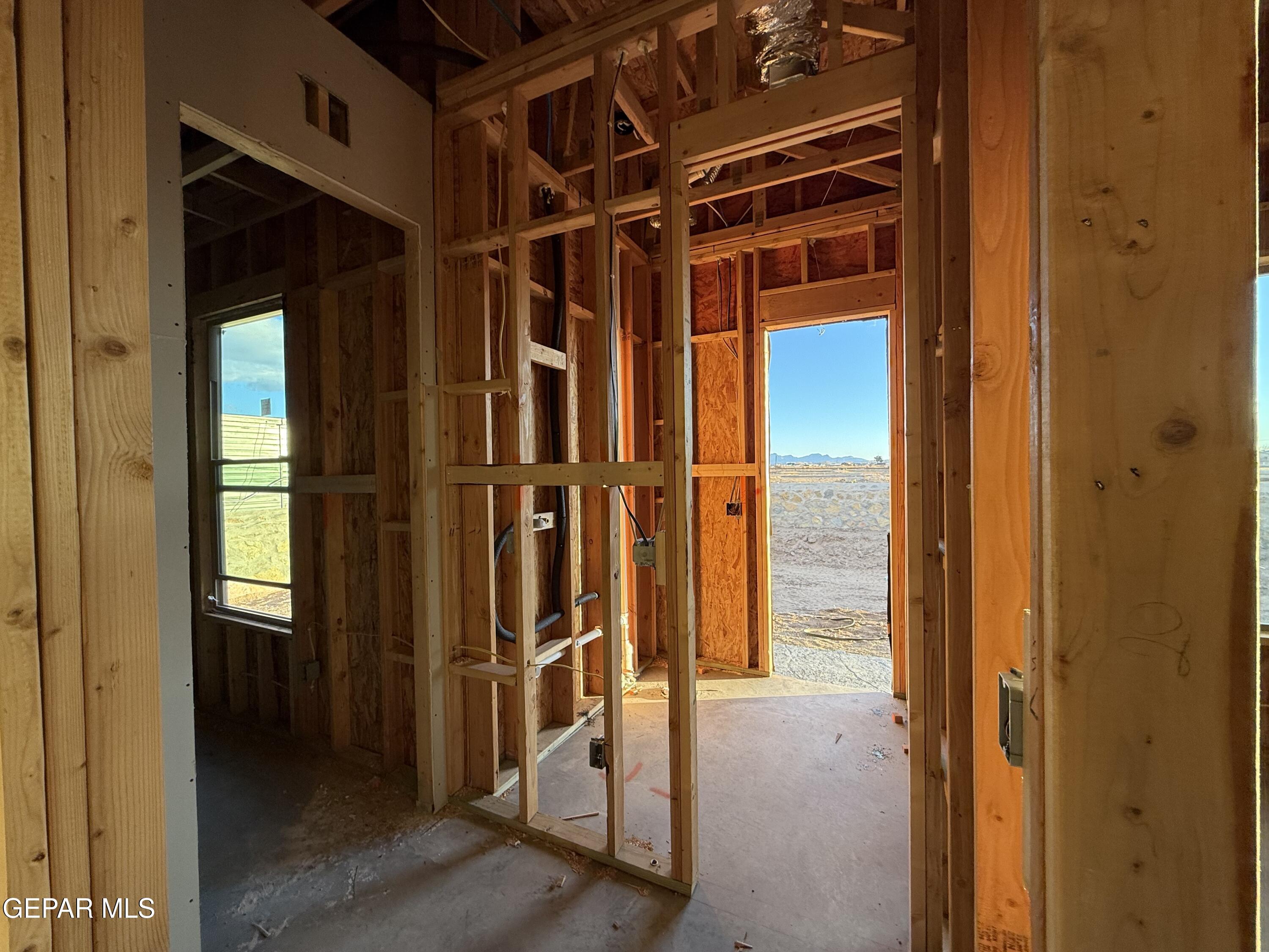 320 Rio Del Rancho Court El Paso, TX 79932 - Photo 19 of 25 a view of a hallway with wooden floor and stairs