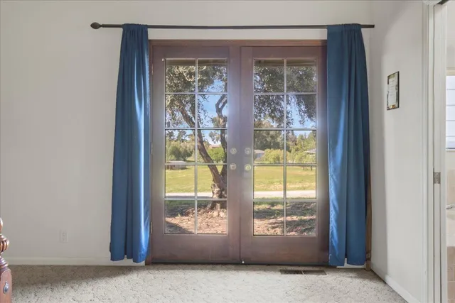 a bathroom with a bathtub sink and mirror