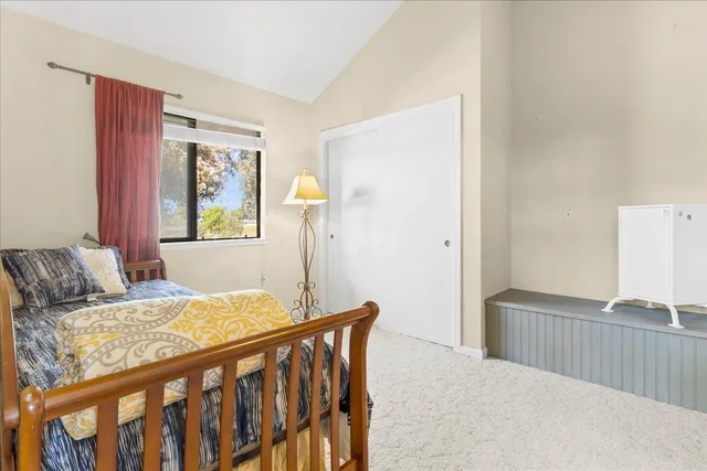 a bedroom with a bed and window