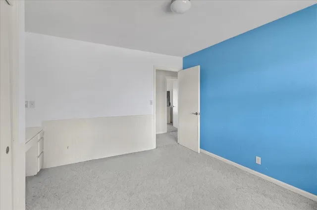 a bathroom with a double vanity sink a mirror and a shower