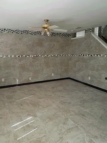 an empty room with wooden floor