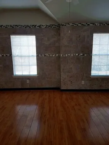 a view of gallery with wooden floor