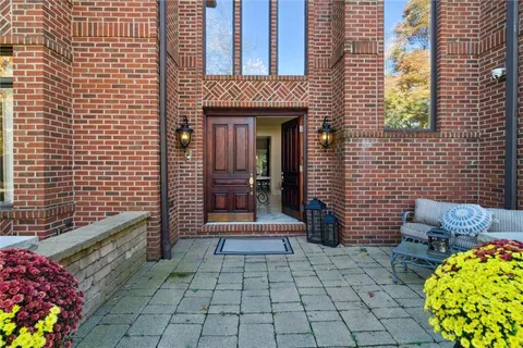 a view of front door of house with outdoor seating
