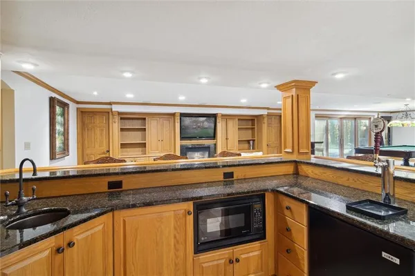 a kitchen that has a sink and a stove in it