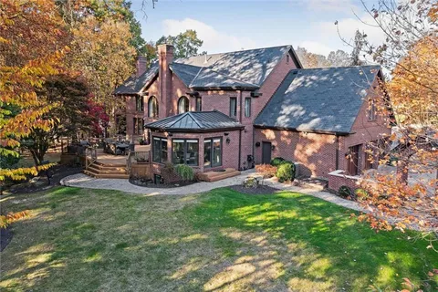 a view of a house with a yard porch and sitting area