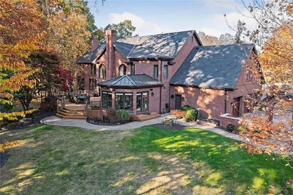 a view of a house with a yard porch and sitting area