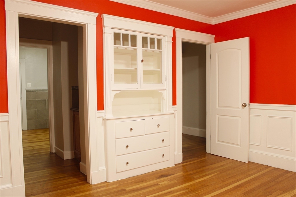45-47 Coolidge Road, Unit 2 Boston, MA 02134 - Photo 3 of 11 a view of a bedroom with wooden floor