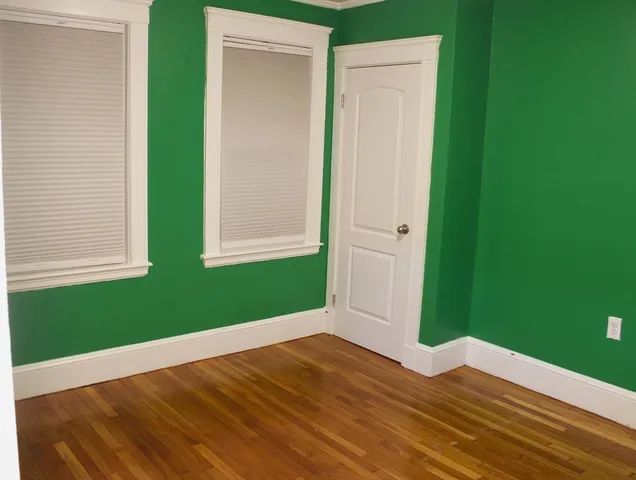 a view of outdoor space and wooden floor