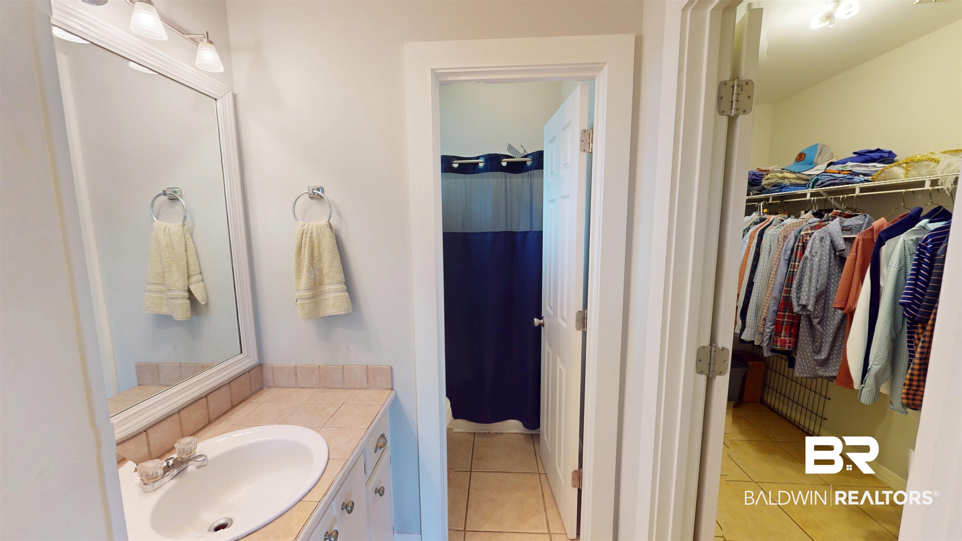 51 Bishop Lane South Mobile, AL 36608 - Photo 14 of 19 Full bathroom with light tile patterned floors, vanity, and curtained shower