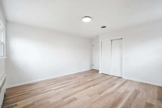a bathroom with a toilet a sink and a mirror