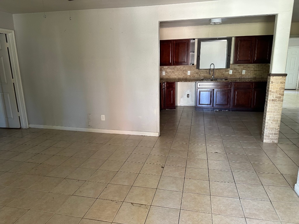930 South Utah Street La Porte, TX 77571 - Photo 7 of 8 a kitchen with stainless steel appliances a sink and cabinets