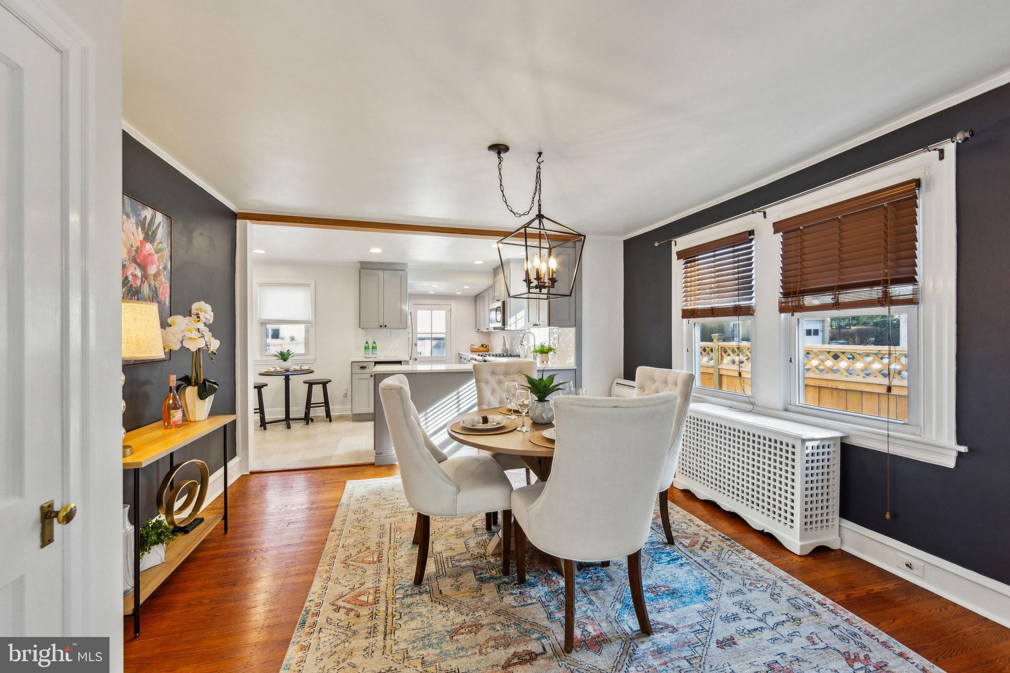 2423 Avon Road Ardmore, PA 19003 - Photo 11 of 37 a dining room with furniture a chandelier and wooden floor